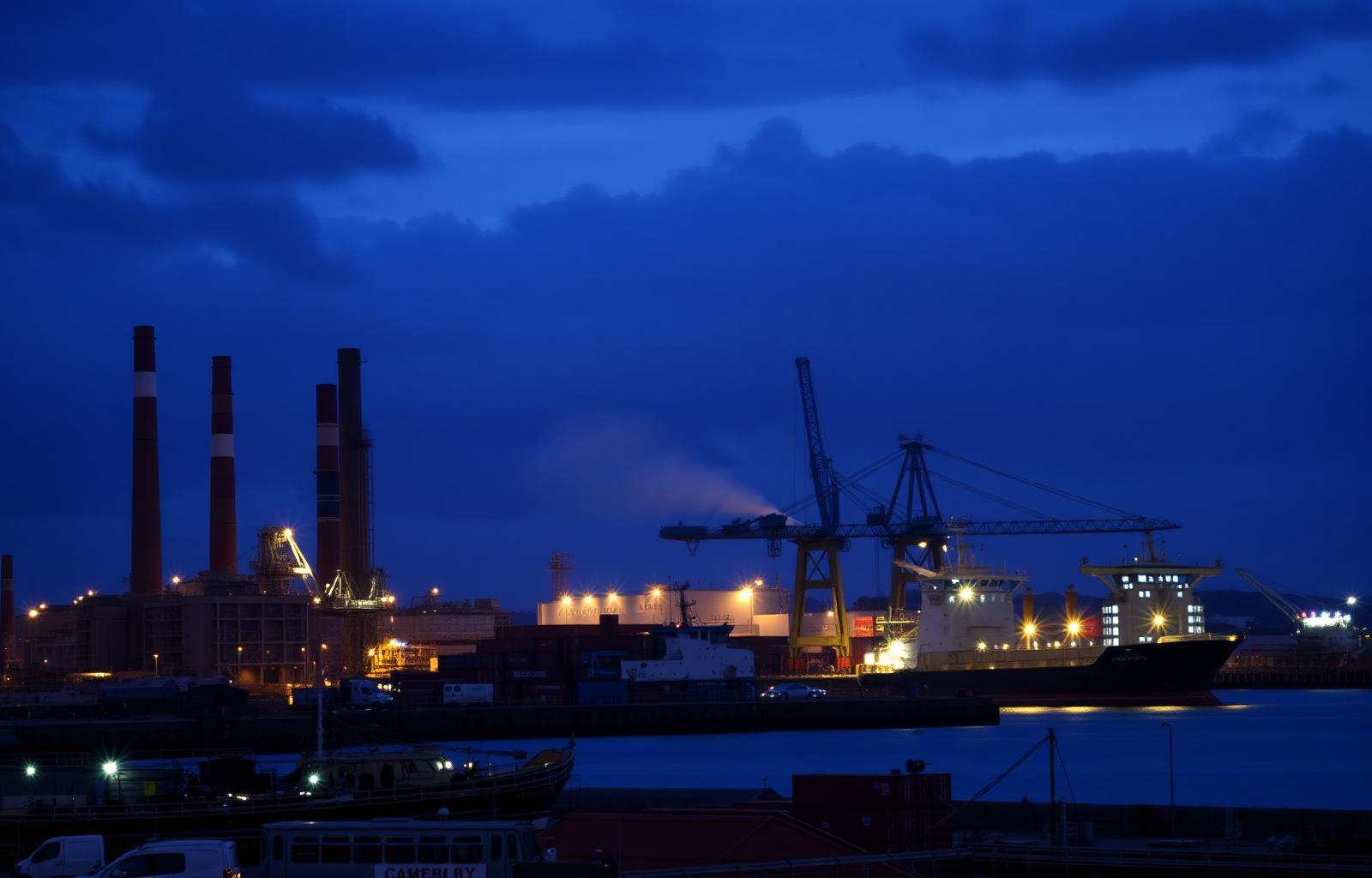 Port Kembla industrial port at dusk with steelworks chimneys